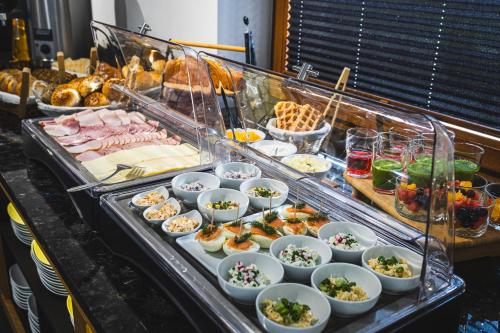a buffet with a lot of food on a table at DW Szarotka in Białka Tatrzanska
