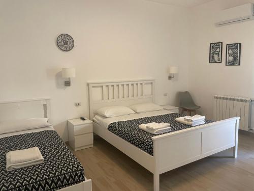 Postel nebo postele na pokoji v ubytování Anto's Apartment - Giardini Naxos