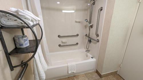 a bathroom with a shower and a bath tub at Best Western Plus Philadelphia Bensalem Hotel in Bensalem