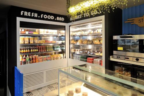 a store with an open refrigerator with food inside at Stayso by Cloud7 Hotels in Istanbul