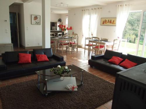 a living room with two black couches and a table at Prestig house in Danestal