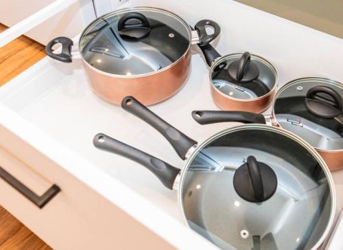a group of pots and pans on a stove at Newly Remodeled Family Friendly Home in Page
