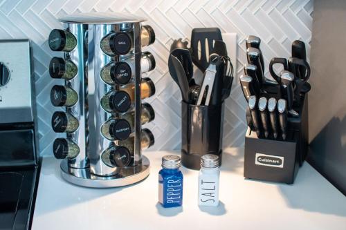 a kitchen counter with a knife block and utensils at Serenity Pearl Escape in Saint Augustine