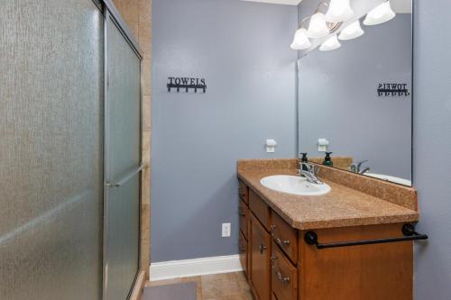 a bathroom with a sink and a shower at CozyLiving in Billings
