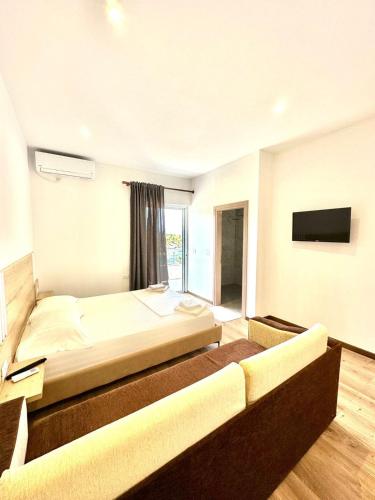 Katil atau katil-katil dalam bilik di Apartaments Rraku