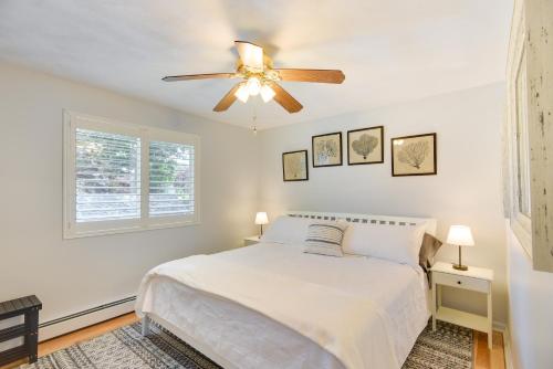 a bedroom with a bed and a ceiling fan at Narragansett Vacation Rental Near River and Beach! in Narragansett