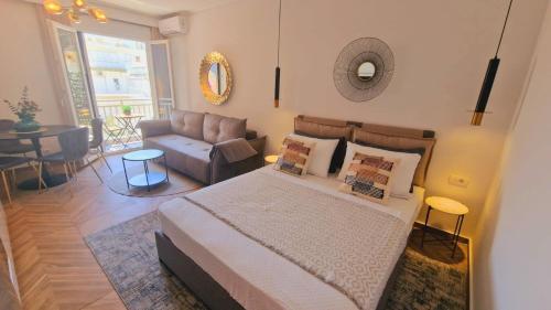 a bedroom with a bed and a couch at Luxury apartments in DOWNTOWN of Perea in Perea
