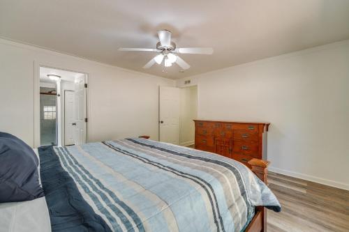 a bedroom with a bed and a ceiling fan at Fire Pit and Stunning Lake Views Shell Knob Home! in Shell Knob
