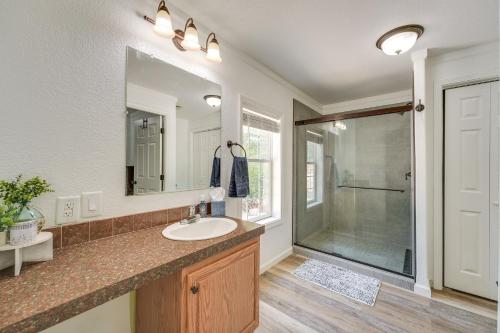 a bathroom with a sink and a shower at Fire Pit and Stunning Lake Views Shell Knob Home! in Shell Knob