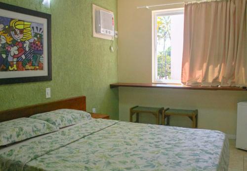 Ένα ή περισσότερα κρεβάτια σε δωμάτιο στο Hotel Pousada do Sol
