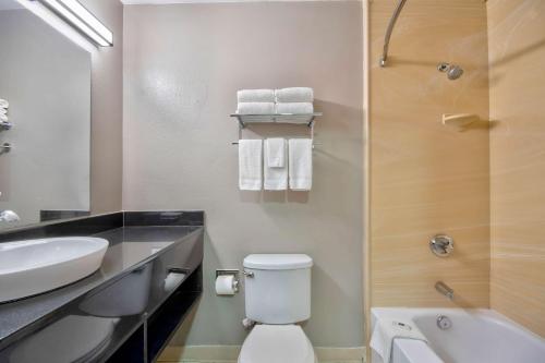 a bathroom with a toilet and a sink and a shower at Studio 6-San Antonio, TX - Six Flags in San Antonio