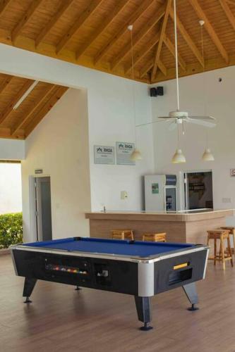 a living room with a pool table in a room at Villa Paradiso in Richmond
