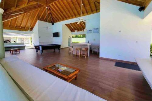 a living room with a pool table and a piano at Villa Paradiso in Richmond