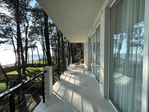 a balcony of a house with a view of the ocean at LIMANI in Grigoleti