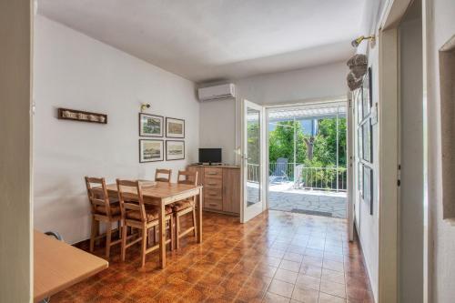 a kitchen and dining room with a table and chairs at Holiday house with a parking space Jadrija, Sibenik - 20641 in Šibenik