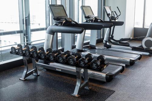 a row of tread machines in a gym at THE BLOSSOM HIBIYA in Tokyo