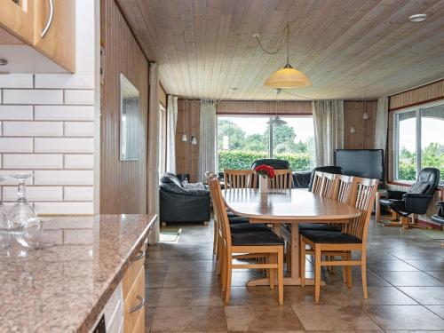 a kitchen and dining room with a table and chairs at Luxury Retreat by Bonnerup - By Traum Ferienwohnungen in Glesborg