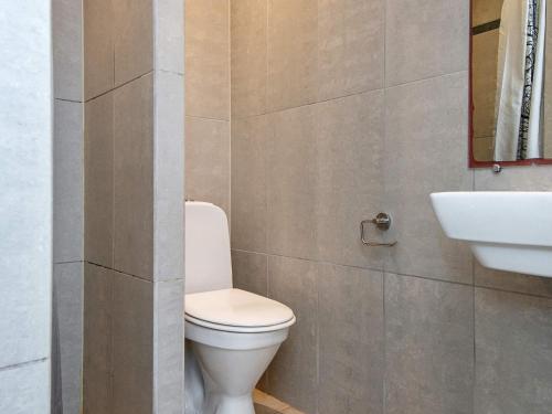 a bathroom with a toilet and a sink at Luxury Retreat by Bonnerup - By Traum Ferienwohnungen in Glesborg