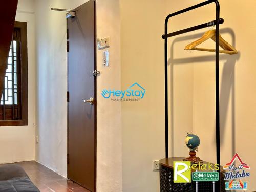 a view of a room with a door and a table at Wayfarer Guest House Jonker Street Melaka By Heystay Management in Melaka