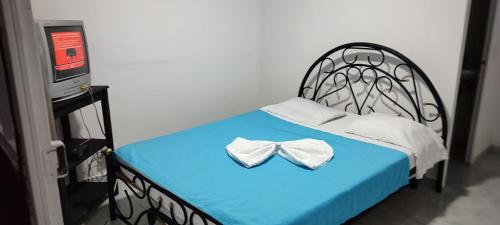 Een bed of bedden in een kamer bij Quinta Villa Sarita Melgar Tolima