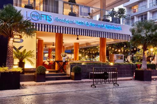 a shopping cart in front of a building at BYD Lofts - Boutique Hotel & Serviced Apartments - Patong Beach, Phuket in Patong Beach