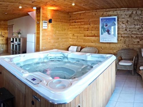 a large jacuzzi tub in a room at Chalet Le Corbier, 8 pièces, 16 personnes - FR-1-267-257 in Villarembert
