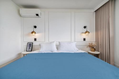 Ein Bett oder Betten in einem Zimmer der Unterkunft Apartamentos Go Living & Suites by HOUSY HOST