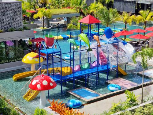 a pool with a water park with a water slide at Anantara Vacation Club Mai Khao Phuket in Mai Khao Beach