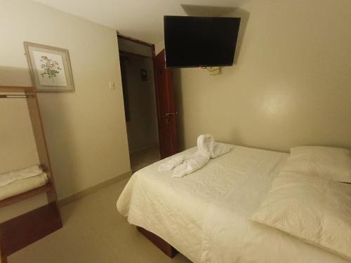 Postel nebo postele na pokoji v ubytování Hotel la encantada
