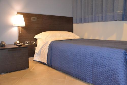 Кровать или кровати в номере Corte Roma