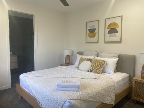 a bedroom with a bed with a tray on it at Ranch Retreat in Kewarra Beach