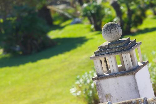 a bird house with a ball on top of it at Masseria dei Monaci in Otranto