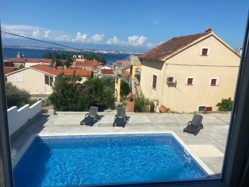 a view of a swimming pool from a house at Ana in Preko