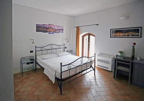 Postel nebo postele na pokoji v ubytování Hotel Antichi Cortili