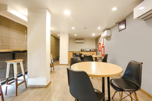 a meeting room with tables and chairs in a building at FabExpress PP Residency in New Delhi