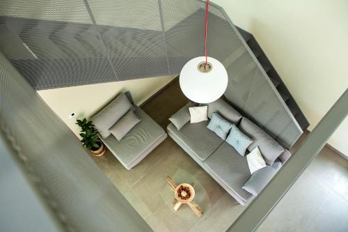 an overhead view of a living room with a couch at Riverstone Villas with private pools in Levktron