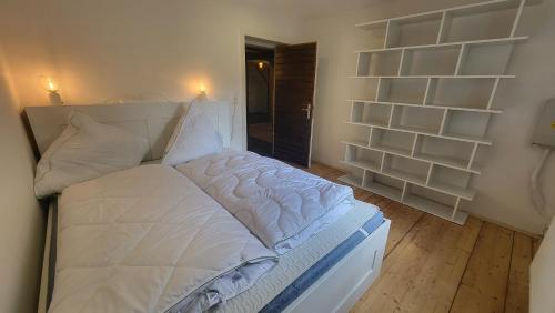 Ένα ή περισσότερα κρεβάτια σε δωμάτιο στο Ferienhaus Heart's Home Hahnenklee Harz