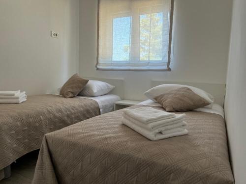 Posteľ alebo postele v izbe v ubytovaní Apartment Rovci 1