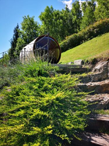 a boat sitting on top of a grassy hill at La Cascata Chambres d'hôtes in La Salle