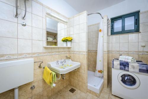 a bathroom with a sink and a shower at Villa Balic in Gruda