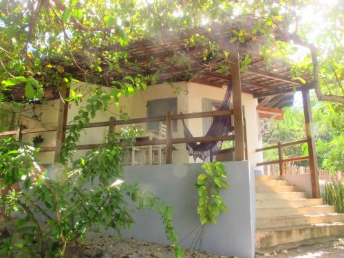 a house with stairs and trees in front of it at Stay Cool Pipa in Pipa