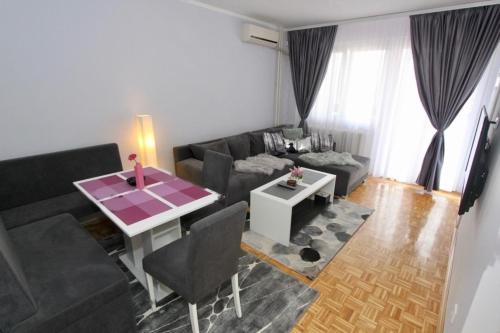 Χώρος καθιστικού στο Cezar Apartment