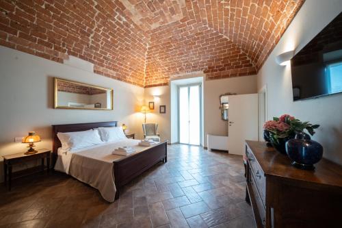 Postel nebo postele na pokoji v ubytování Cascina Baronina