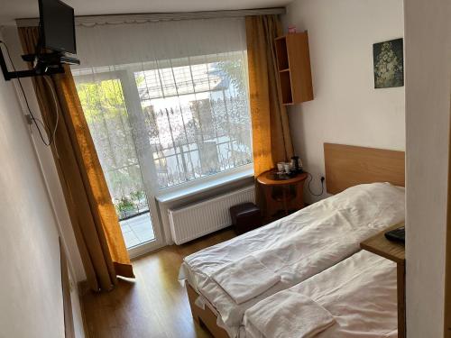 Postel nebo postele na pokoji v ubytování Poręba