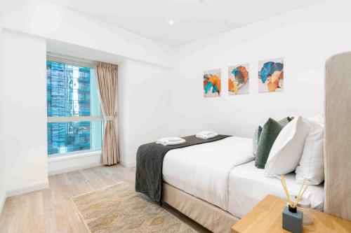 Postel nebo postele na pokoji v ubytování Marina Heights Tower - Vigor Vacations Homes