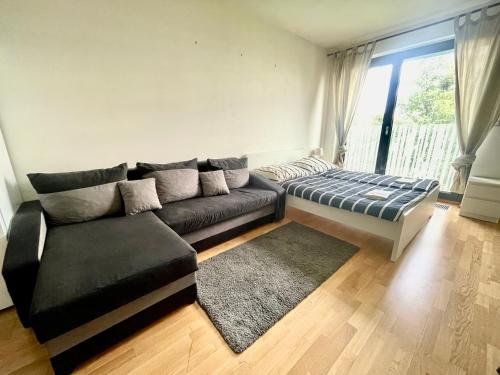 En eller flere senge i et værelse på Garden Park Studio