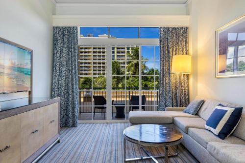 a living room with a couch and a table at Unique 1BR Suite Condo Located at Ritz Carlton-Key Biscayne in Miami