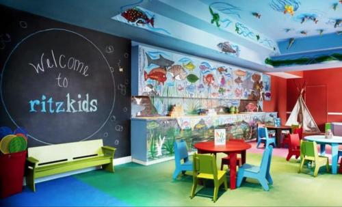 a childrens play area with colorful chairs and tables at Unique 1BR Suite Condo Located at Ritz Carlton-Key Biscayne in Miami