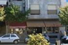 a white car parked in front of a building at Hotel Classis in Bragança