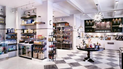 a shop with a checkered floor and a table in a room at Lovely Deluxe Unit Located at Ritz Carlton - Key Biscayne! in Miami